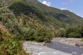 Stepantsminda - Confluence of Black and White Aragvi rivers, Caucasus Mountains. Georgian military Highway