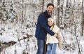 stepfather and daughter on forest in winter season