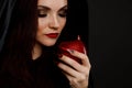 Stepmother witch gives poisoned red apple