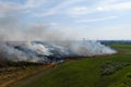 Steppe fire. Burning dry grass, fire smoke Royalty Free Stock Photo