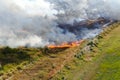 Steppe fire. Burning dry grass, fire smoke Royalty Free Stock Photo