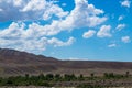 Steppe landscapes of Kazakhstan. Sky with clouds over the mountains