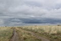 Steppe road going into the stormy sky Royalty Free Stock Photo