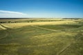 steppe rural landscape sun-scorched grass road and blue sky Royalty Free Stock Photo