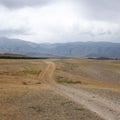 Steppe, rural road Royalty Free Stock Photo