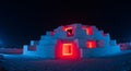 Stepped ice structure illuminated intensely red and blue Royalty Free Stock Photo