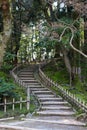 Stepped path with bamboo fence winding up hillside, at Kenrokuen gardens. Kanazawa, Japan Royalty Free Stock Photo