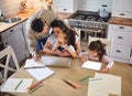 Stepping in and doing his part. two parents helping their children with homework. Royalty Free Stock Photo
