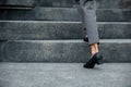 Closeup legs of businesswoman hurry up walking on stairway