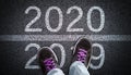 Stepping From 2019 Into New Year 2020 Concept Royalty Free Stock Photo