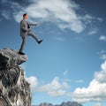 Stepping off a cliff ledge Royalty Free Stock Photo