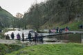 Tourists crossing the busy stepping stones, Peak District, Derbyshire Royalty Free Stock Photo