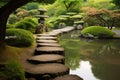 stepping stones and pathways leading to serene japanese garden Royalty Free Stock Photo