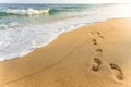 Steps on the beach to sea with wafe in sunny day Royalty Free Stock Photo