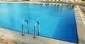 Steps in blue water pool Royalty Free Stock Photo