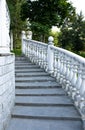 Steps of the classic staircase with white balusters go up Royalty Free Stock Photo