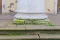 Steps and columns of the building are cracked and covered with moss Royalty Free Stock Photo