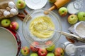 Steps of cooking apple pie. Fresh harvest apples, cinnamon, flour, sugar, butter, eggs, milk and baking mold Royalty Free Stock Photo