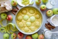 Steps of cooking apple pie. Fresh harvest apples, cinnamon, flour, sugar, butter, eggs, milk and baking mold Royalty Free Stock Photo