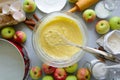 Steps of cooking apple pie. Fresh harvest apples, cinnamon, flour, sugar, butter, eggs, milk and baking mold Royalty Free Stock Photo