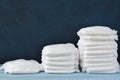 Three stacks of diapers on a blue background with copy space Royalty Free Stock Photo