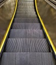 Steps of an escalator going down. Royalty Free Stock Photo