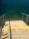 Steps leading down into the water Royalty Free Stock Photo