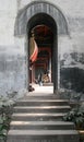 Steps leading into a narrow archway of the drum room in a Chinese Temple