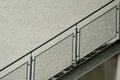 Steps with metal stair string at plastered facade Royalty Free Stock Photo