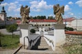 Steps from Most Holy Trinity church to Komenskeho square with town hall left in Fulnek