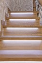 Steps of oak staircase with LED backlight Royalty Free Stock Photo