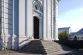 Steps and portal of the baroque bell tower in the territory of Trinity Monastery of St. Sergius. Sunny spring view.