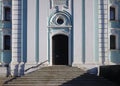 Steps and portal of the baroque bell tower in the territory of Trinity Monastery of St. Sergius. Sunny spring view.