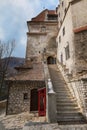 Steps of a stone staircase leading to the medieval Bran castle Dracula`s castle in Romania