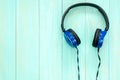 Stereo headphones on blue wooden background Royalty Free Stock Photo