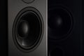 Stereo sound speakers closeup on black background with copy space