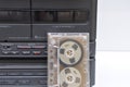 Stereo system, black, vintage 90s stereo system with vintage metal cassette tape Royalty Free Stock Photo