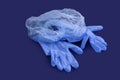 Sterile aseptic surgical glove blue background cap hat top view still life Royalty Free Stock Photo