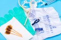 Sterile Foley urinary catheter, Drainage Bag, green vinyl sterile gloves and Povidone Iodine Swabsticks