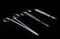 Sterile instruments on a black background close-up. Preparing instruments for surgery Royalty Free Stock Photo