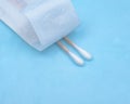 Sterile Long Cotton Tipped Applicators on blue