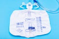 Sterile Urinary Drainage Bag with Anti-Reflux Tower isolated on blue background Royalty Free Stock Photo