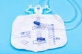 Sterile Urinary Drainage Bag with Anti-Reflux Tower isolated on blue background Royalty Free Stock Photo