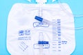 Sterile Urinary Drainage Bag with Anti-Reflux Tower isolated on blue background Royalty Free Stock Photo