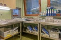 a sterilization department in a hospital are many instrument trays that still need to be packed