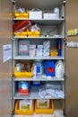 In the sterilization department of a hospital there is the supply cabinet with medical devices