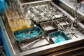 sterilization tray filled with surgical instruments in preparation for