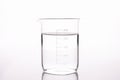 Sterilized water is poured into measuring glass closeup Royalty Free Stock Photo
