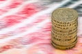 Sterling pound depreciation devaluation reduction value concept closeup macro view at UK currency stack of one pound coins Royalty Free Stock Photo