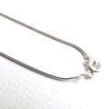 Sterling silver chain with spring clasp for handmade jewelry making on white background. DIY, craft